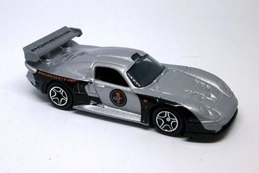 Silver toy Porsche car on a white background
