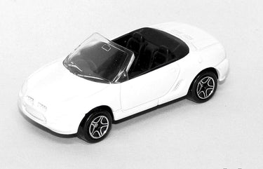 White convertible toy car on a light gray background