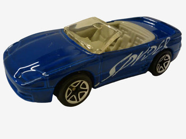 Blue toy convertible car with beige interior on a white background