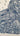 Abstract pattern of stylized Sesame Street characgters with eyes and mouths on a beige background
