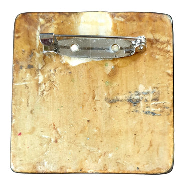 Decorative square pin brooch with artistic Gustuv Klimt design of a dancing lady, featuring swirling patterns and jewelry.  New & vintage jewellery NZ at Planet Retro NZ