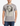 Man wearing a gray t-shirt with a graphic design on a white background