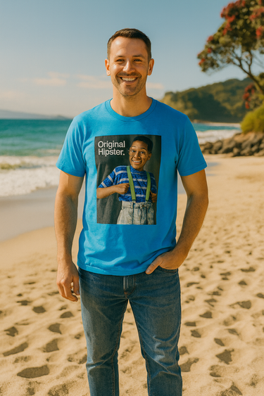 Man wearing a blue t-shirt with a graphic design on a beach