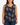 Woman wearing a Planet Retro tank top with angel and 'Don't Blink' print against a plain background