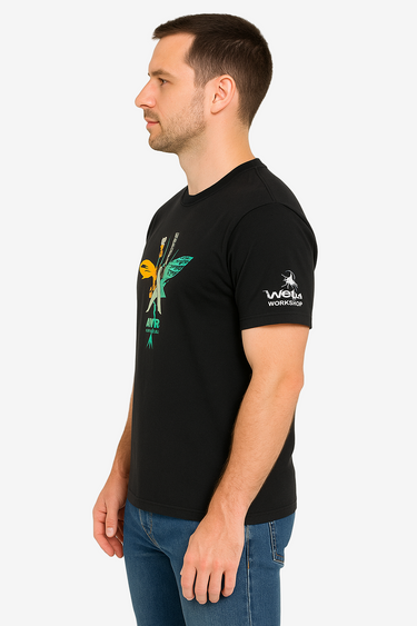 Man wearing a black t-shirt with a logo on the sleeve against a white background