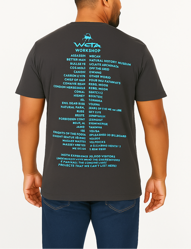 Man wearing a dark gray t-shirt with blue text on the back, standing against a white background