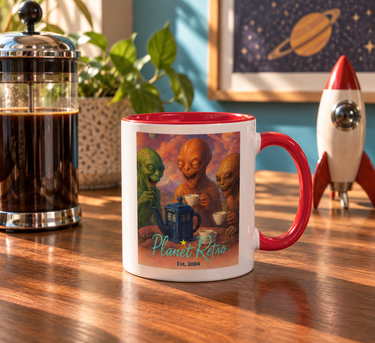 Planet Retro Alien Tea Party coffee mug with red handle in a retro sci-fi coffee setting