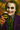 Person dressed as The Joker holding a can with Batman logo against a colorful background
