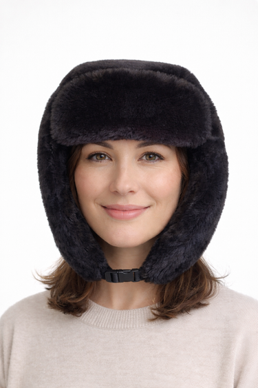 Black faux fur trapper hat with ear flaps and chin clip worn by model at Planet Retro NZ