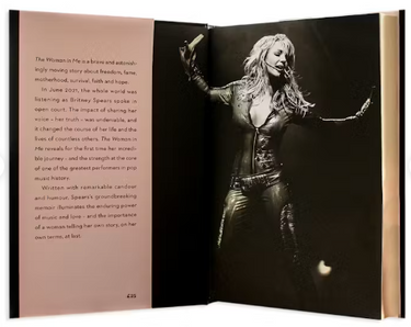 Open book with a black and white photo of a woman on one page and text on the other, set against a white background.