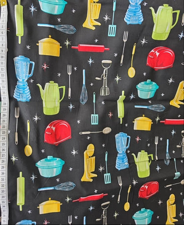 Fabric Traditions atomic kitchen cotton fabric on black showing colourful 1950s appliances and starbursts