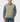 Fairway Outfitters olive green cable knit vest styled over a blue denim shirt