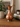 Vintage hammered copper jug with brass handle, showing warm metallic tones and textured decorative finish.
