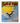 A hardcover book titled 'Footrot Flats: The Long Weekend' by Murray Ball, featuring a colorful cartoon illustration of a black and white dog on a swing against a yellow sun and blue sky, resting on a beige fabric surface.