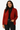 Woman wearing a red cardigan over a black top and pants on a white background
