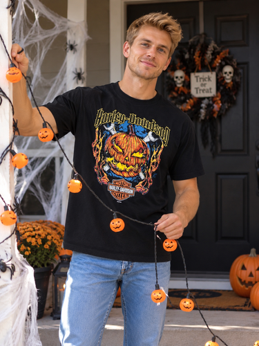 Harley-Davidson pumpkin graphic T-shirt Large styled on man hanging Halloween lights on a porch