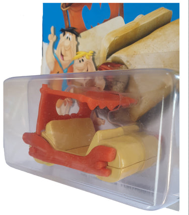2013 Hot Wheels Flintstones Flintmobile diecast vehicle sealed on international blister card.