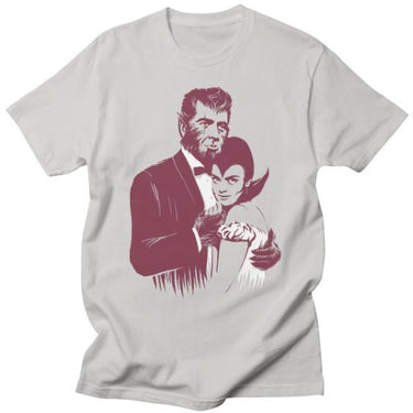 A gray t-shirt with a graphic print of a werewolf and a female character, styled in a vintage horror movie aesthetic.