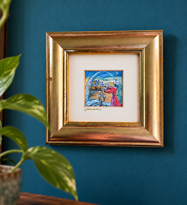 Jerusalem Miniatures framed artwork with gold signature displayed on teal wall beside fresh greenery