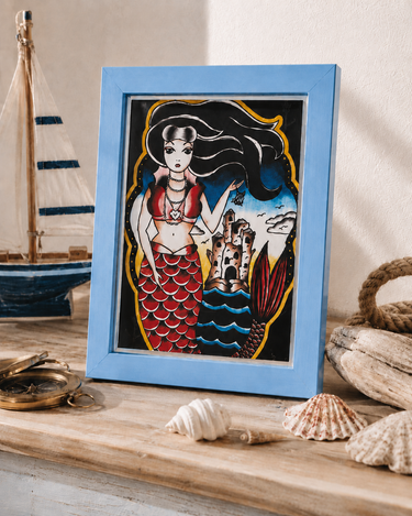 Blue plastic desktop frame with Jubly Umph mermaid art print