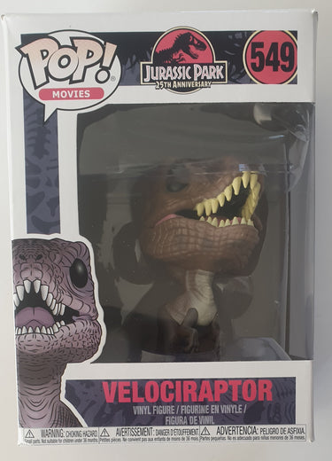 A Funko Pop Vinyl figure of a Velociraptor from Jurassic Park with black eyes and visible teeth.