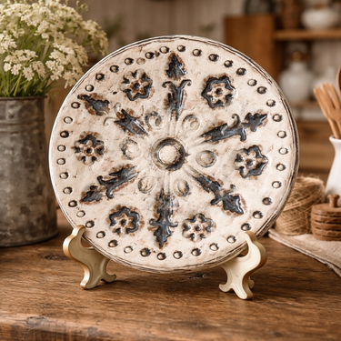 Decorative plate on a stand with a rustic kitchen setting