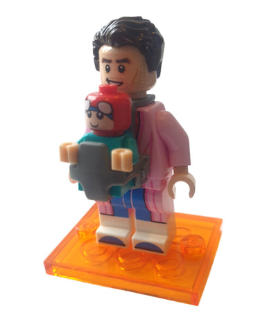 Lego Spider-Man and Mayday Parker minifigures from Spider-Verse series 71050 featuring Spider-Man in red and blue suit holding baby Mayday displayed on a light grey background