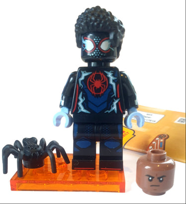 Lego Spider-Man Miles Morales minifigure from Spider-Verse series 71050 in black and red suit with web accessory displayed on a light grey background