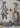 Close-up of skull-headed figures in period clothing on Lord and Lady Skullington cushion cover