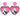 Pair of pink glitter Michael Myers Halloween heart-shaped acrylic stud drop earrings on a light background