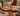 Natural burr wood sculptural candle holders styled with lit tealights