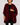 Woman wearing a berry velvet Planet Retro throw cape with dramatic draped silhouette and crushed velvet texture.