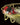 Gold and red pendant on a dark background