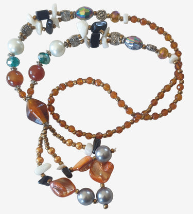 Colorful beaded necklace on a light background