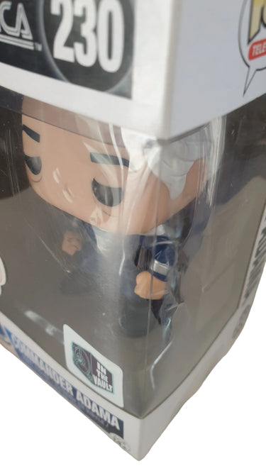 Action figure in packaging with visible branding on a white background