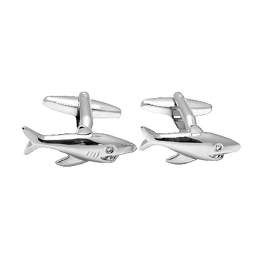 silver metal shark fish cufflinks on a blank background