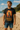 Man wearing a 'Stranger Things' t-shirt on a beach.  Planet Retro NZ