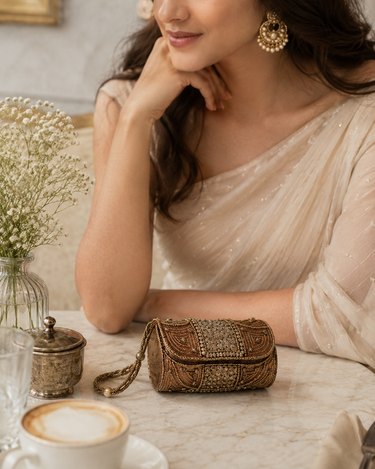 Tiny bronze beaded cylinder clutch bag with wrist strap at Planet Retro NZ.