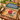 Vintage ethnic tableware textiles styled together on a wooden dining table