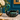 Vintage Blue Mountain Pottery green swan planter styled on marble against a teal blue wall