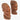 Two hand-carved wooden African-style bust sculptures displayed on a white draped surface against a plain white wall.