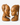 A pair of hand-carved wooden sculptures depicting two female busts facing each other, set against a plain light gray background.
