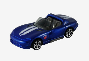 Toy car in packaging with 'Matchbox' branding on a white surface.