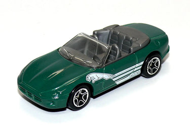 Green convertible toy car with a white stripe on a white background
