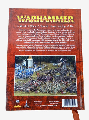 Back cover of a Warhammer book on a wooden surface