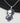 Necklace with a pendant featuring an anime-style character on a white background