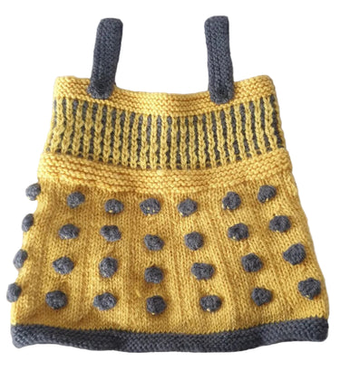 Knitted costume with yellow body and gray polka dots on a white background