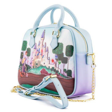 A crossbody handbag featuring a printed design with a fairy tale castle and characters in a pastel color palette, with a chain shoulder strap. Planet Retro NZ